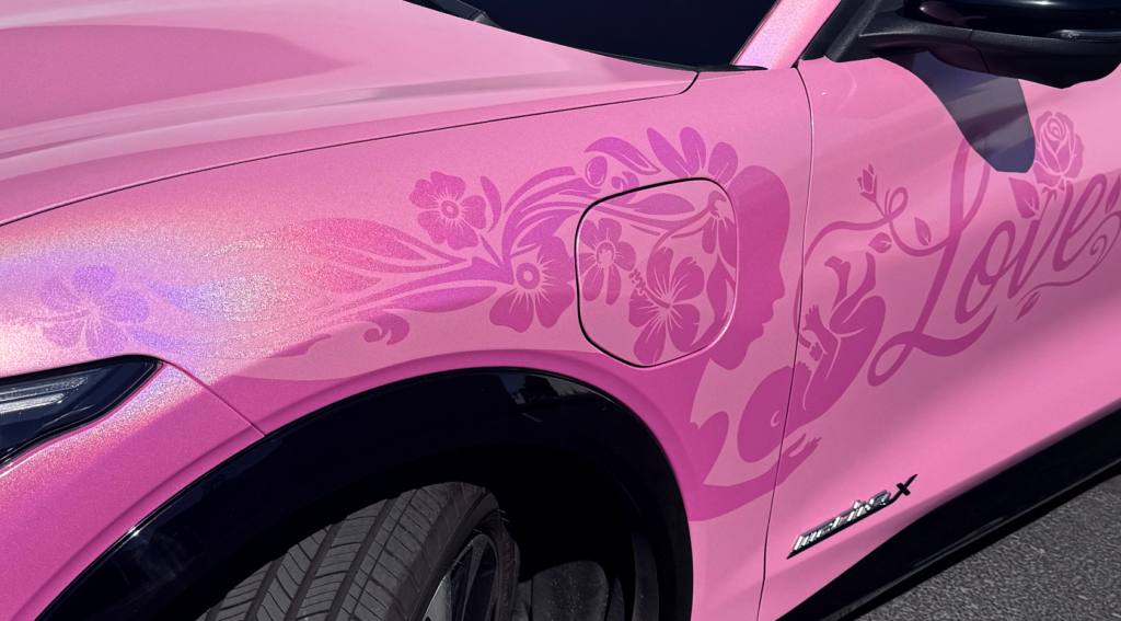 Pink Ford Mustang Mach-E with custom cut vinyl graphics