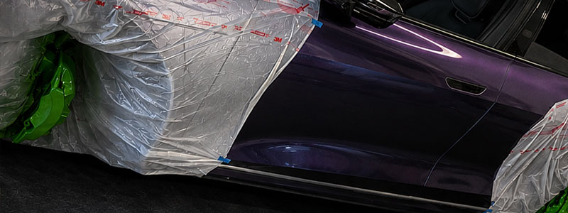 Lucid Air masked for custom green brake caliper painting