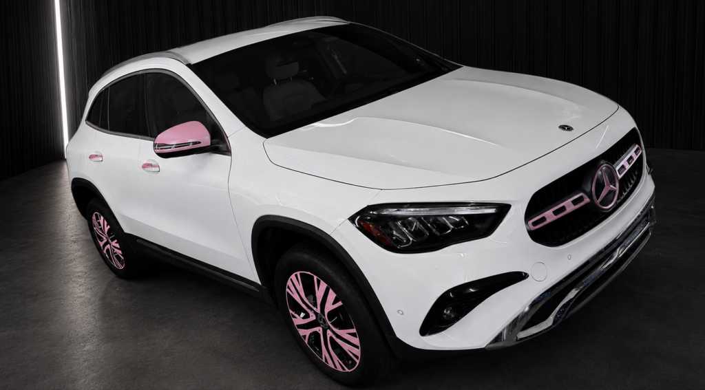 White Mercedes-Benz customized with pink vinyl wrap accents