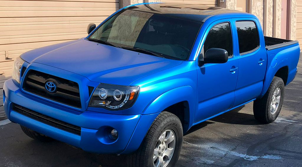 Stain Blue pickup truck showcasing a full color-change vinyl wrap